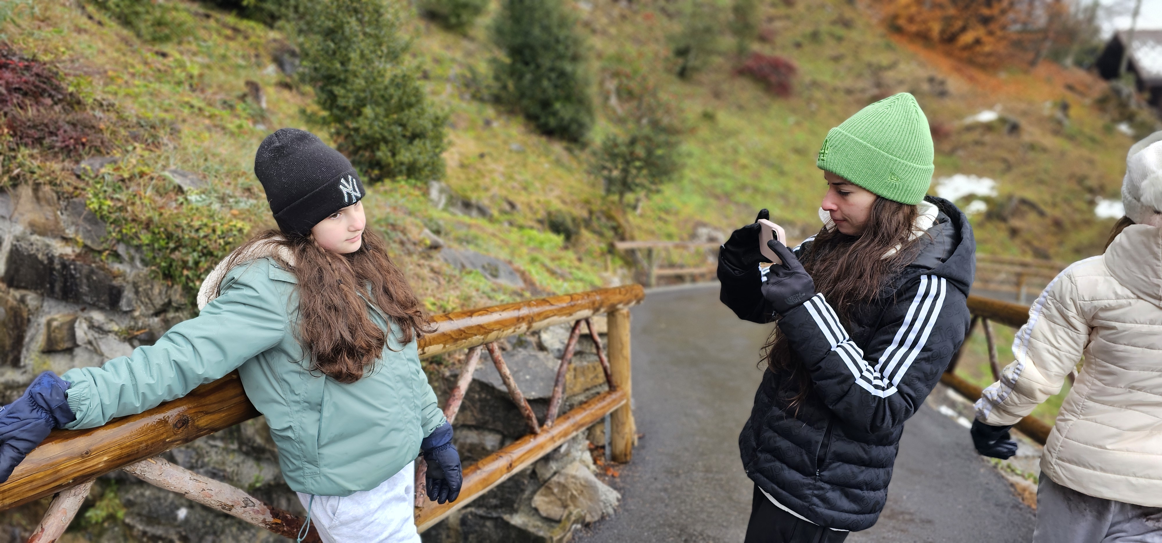 Samira photographing Lulu on the wooden rail path at the cave-park grounds