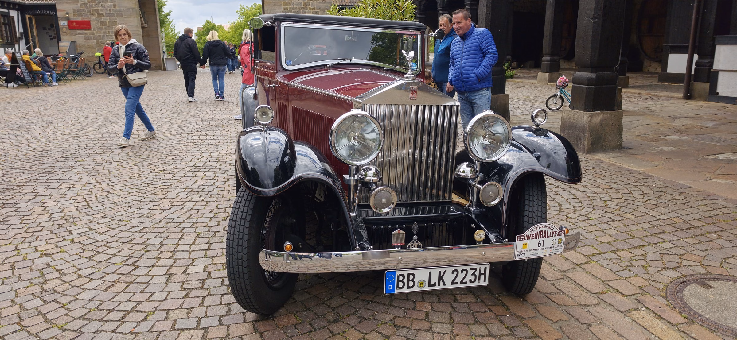 Vintage maroon Rolls Royce parked at the Deutsches Weintor with a German Sonderkennzeichen plate