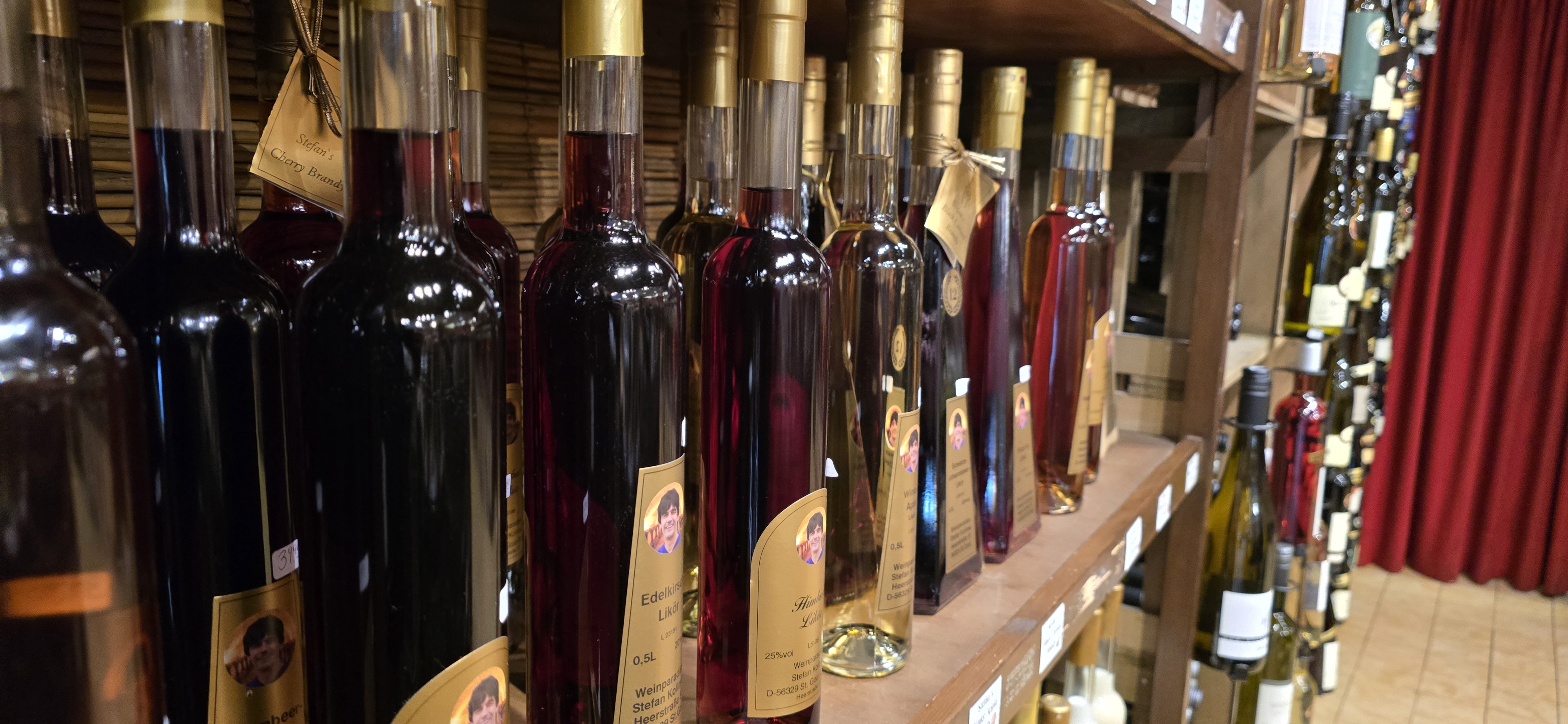 Liqueur and Edellikör bottles on a shelf at Stefans Wein- und Weihnachts-Paradies in St. Goar